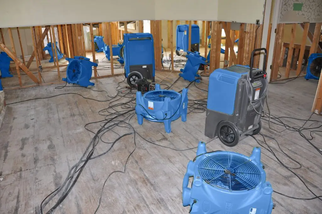 Air movers drying a gutted Fort Collins room after major water damage